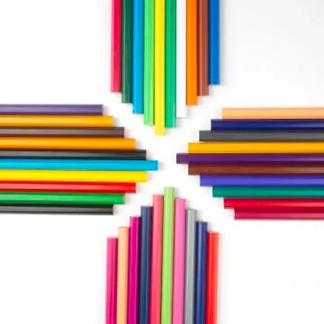 Colored pencils for drawing on a white background. Education and creativity.  Stock Photos