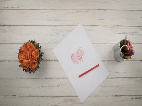 Colored pencils fall on a stylish white wooden table. Clow mo. Top view. Hands Stock Footage 84890780