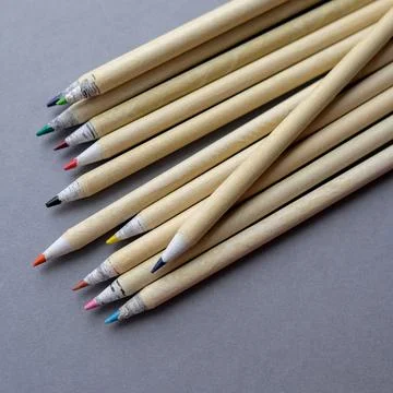 Colored pencils on a gray background. Square color image Stock Photos