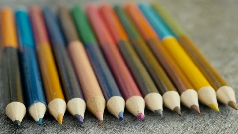 Colored pencils on grey background. Stock Footage 103451553