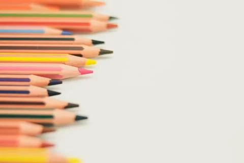 Colored pencils from the left, well sharpened, on white background Stock Photos