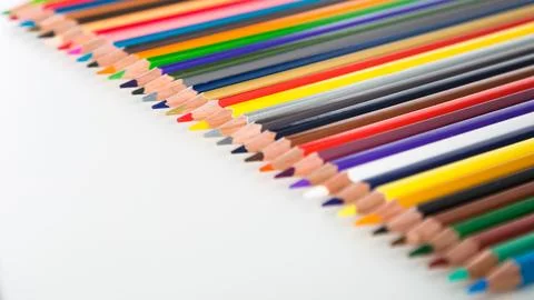 Colored pencils lying in row Stock Photos