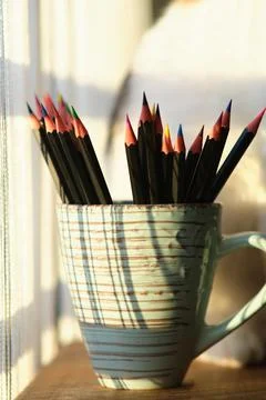 Colored pencils in a mug Stock Photos