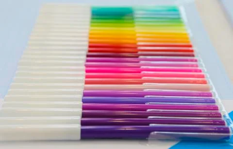 Colored pencils rainbow lined inline on a table Stock Photos