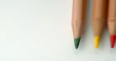 Colored pencils roll into frame in slow motion Stock Footage 113142876