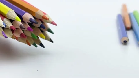 Colored pencils rolling in from the left Stock Footage 194006302