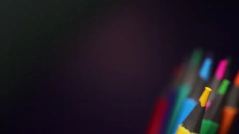 Colored Pencils Rotate Around the Circle. Pencils Isolated on Black Backgrou Stock Footage 250777364