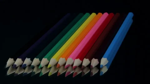 Colored Pencils Rotating on a Black Table. Vídeo Stock 52206381