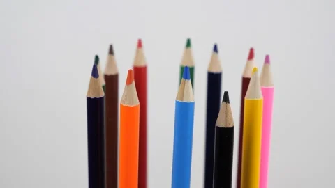 Colored pencils rotating in a circle Stock Footage 142136966