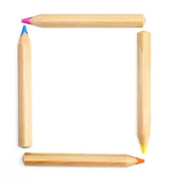 Colored pencils set as a frame on white Stock Photos