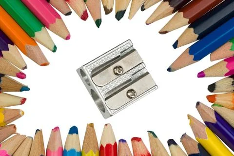 Colored pencils with a sharpener in the middle Foto stock