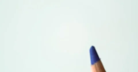 Colored Pencils spin through edge of frame on white background Stock Footage 113143070