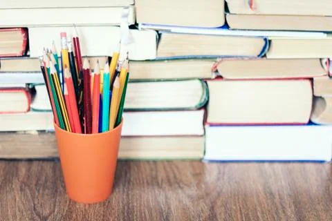 Colored pencils with Stack of book education concept background. Stock Photos