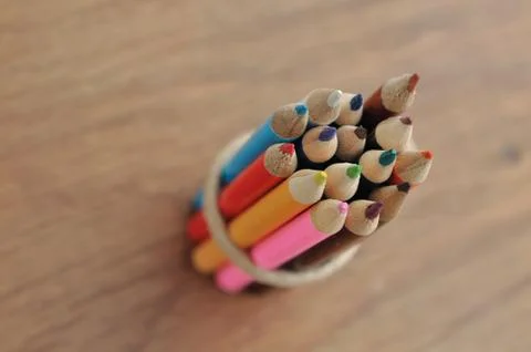 Colored pencils stringed Stock Photos