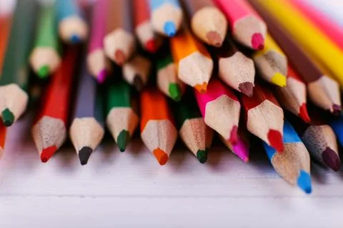 Colored pencils, on white background, pattern, copy space. Stock Photos