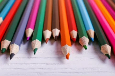 Colored pencils, on white background, pattern, copy space. Stock Photos