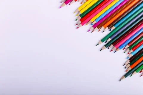 Colored pencils, on the white background, pattern, copy space. Stock Photos