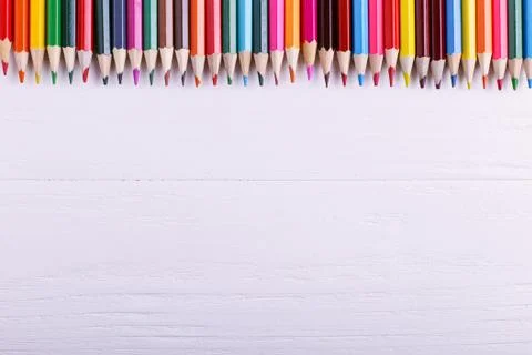 Colored pencils, on the white background, pattern, copy space. Stock Photos