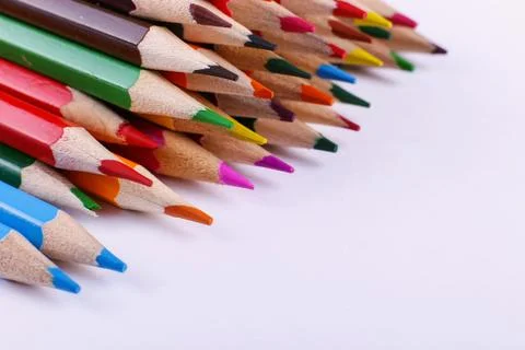Colored pencils, on white background, pattern, copy space. Stock Photos