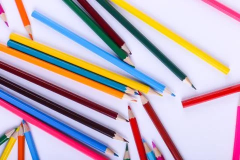 Colored pencils, on white background, pattern, copy space. Stock Photos