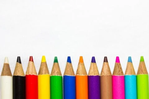 Colored pencils on white background Stock Photos