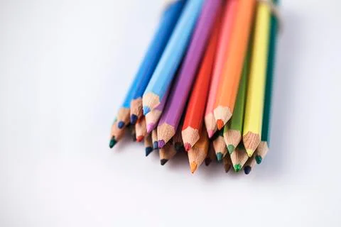 Colored pencils on white background Stock Photos