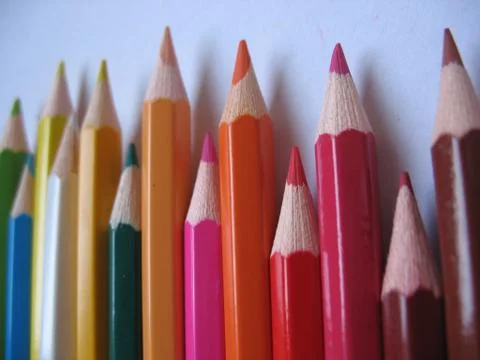 Colored pencils on white background Stock Photos