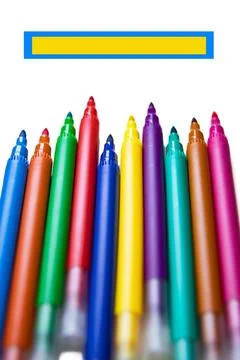 Colored pencils on a white background, pointing towards the space for the i.. Foto stock