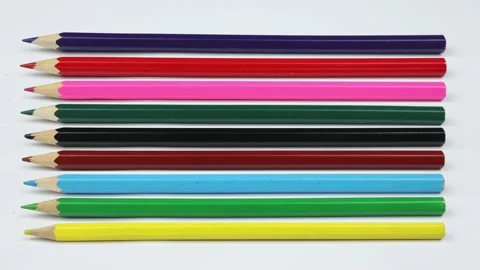 Colored pencils on a white background. Preparation for school, drawing lesson Stock Footage 232419412