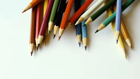Colored pencils on white paper Stock Footage 78913268