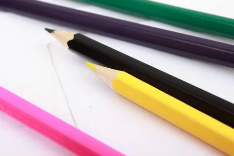 Colored pencils on white sheet Foto stock