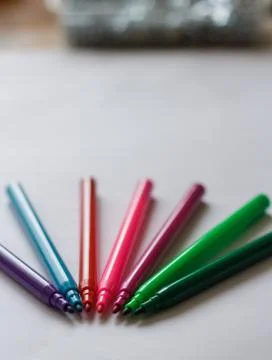 Colored pens without lids vertical view Stock Photos