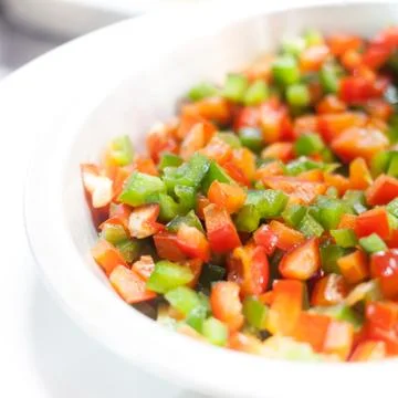 Colored peppers mixed &amp; chopped up Stock Photos