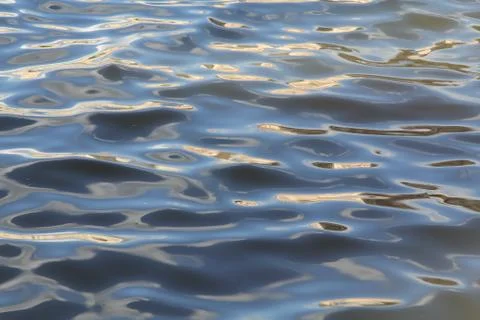 Colored picturesque waves on the river Stock Photos