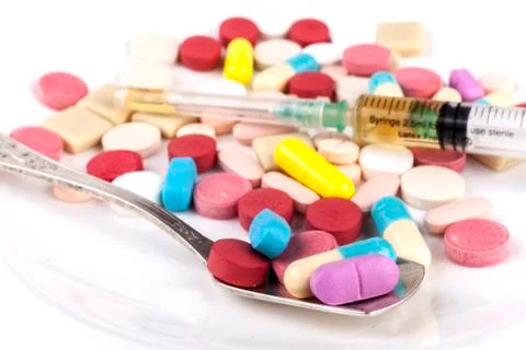 Colored Pills in Spoon Stock Photos