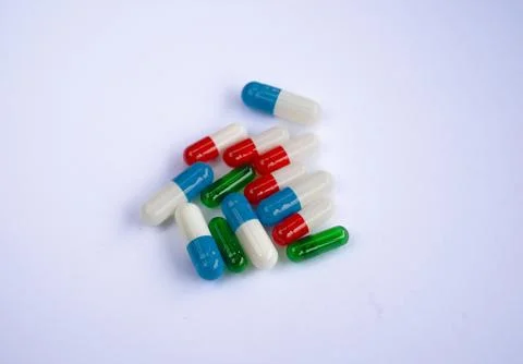 Colored pills on surface Stock Photos