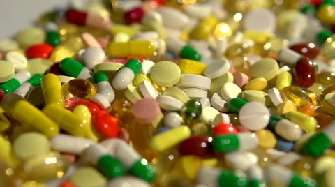 Colored pills on the table. Full HD 1080 video footage. Video stock 55339779