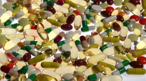 Colored pills on the table. Full HD 1080 video footage. Stock-Footage 55339967