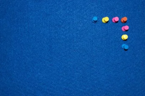 Colored pins on a board Stock Photos