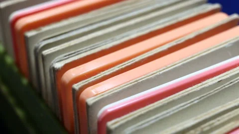 Colored plastic and cardboard frames with photographic film stand in a row one a Stock Footage 149220276