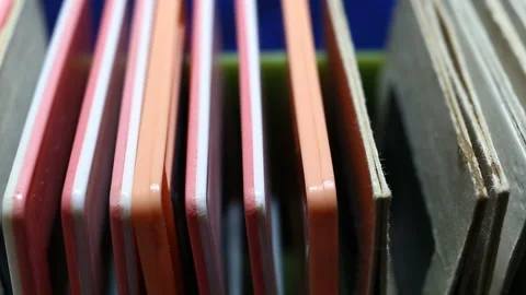 Colored plastic and paper frames standing in a row one after the other. The slid Stock Footage 149220467