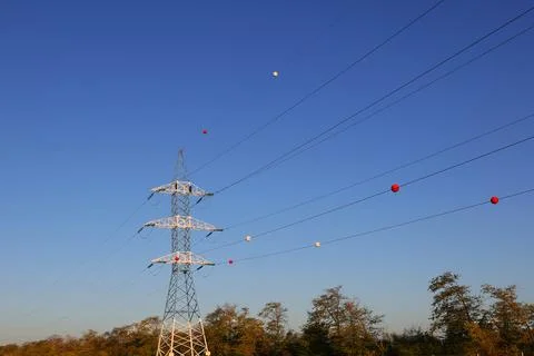 The colored plastic balls hanging on overhead electricity wires are called 库存照片
