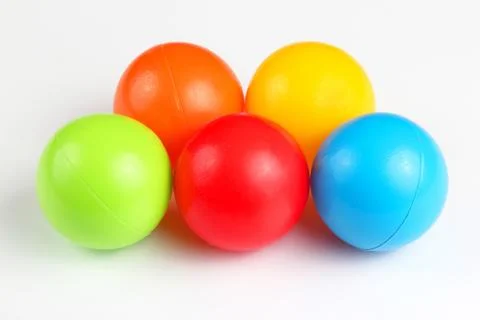 Colored plastic balls on white background Stock Photos