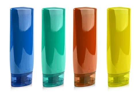 Colored  Plastic Bottle with Shampoo or hygienic cosmetic product isolated on Stock Photos