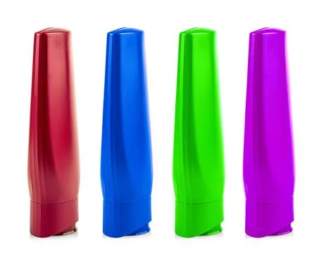 Colored Plastic Bottles with Shampoo or hygienic cosmetic product isolated on Stock Photos
