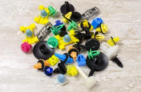 Colored plastic clasp on a light background Foto stock