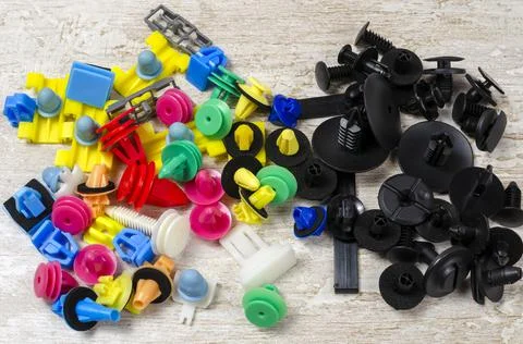 Colored plastic clasp on a light background Foto stock