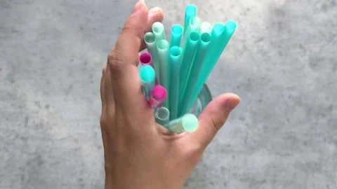 Colored plastic drinking straws Stock Footage 243367567