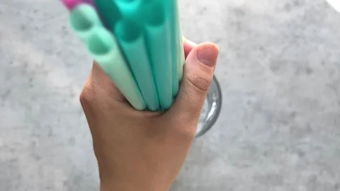 Colored plastic drinking straws Stock Footage 243367577