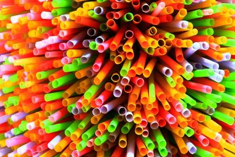 Colored plastic drinking straws on a white background Stock Photos